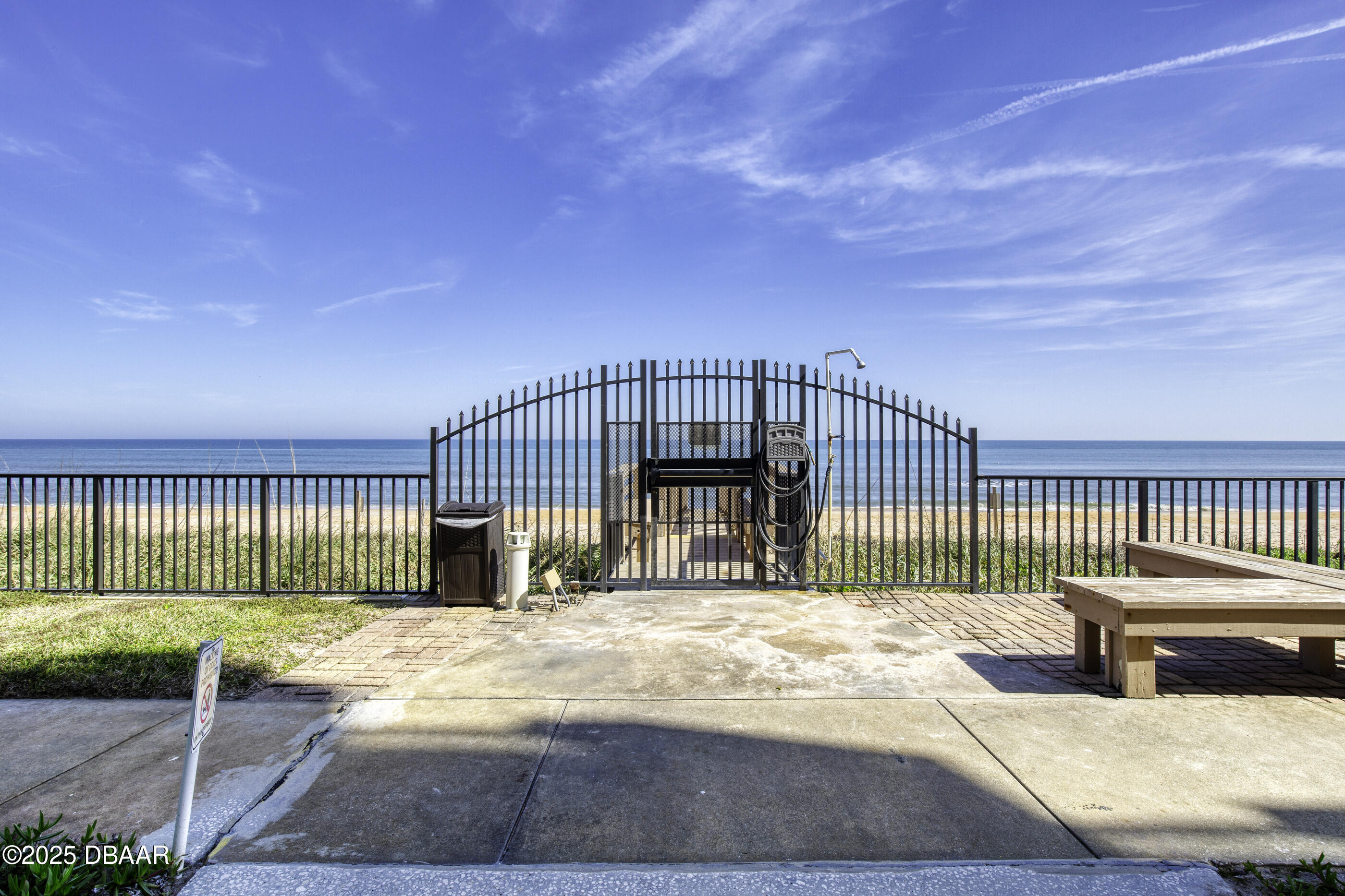 1415 Ocean Shore Boulevard, Unit 1010 Ormond Beach, FL 32176 - Photo 32 of 52 a view of a chair and floor to ceiling window