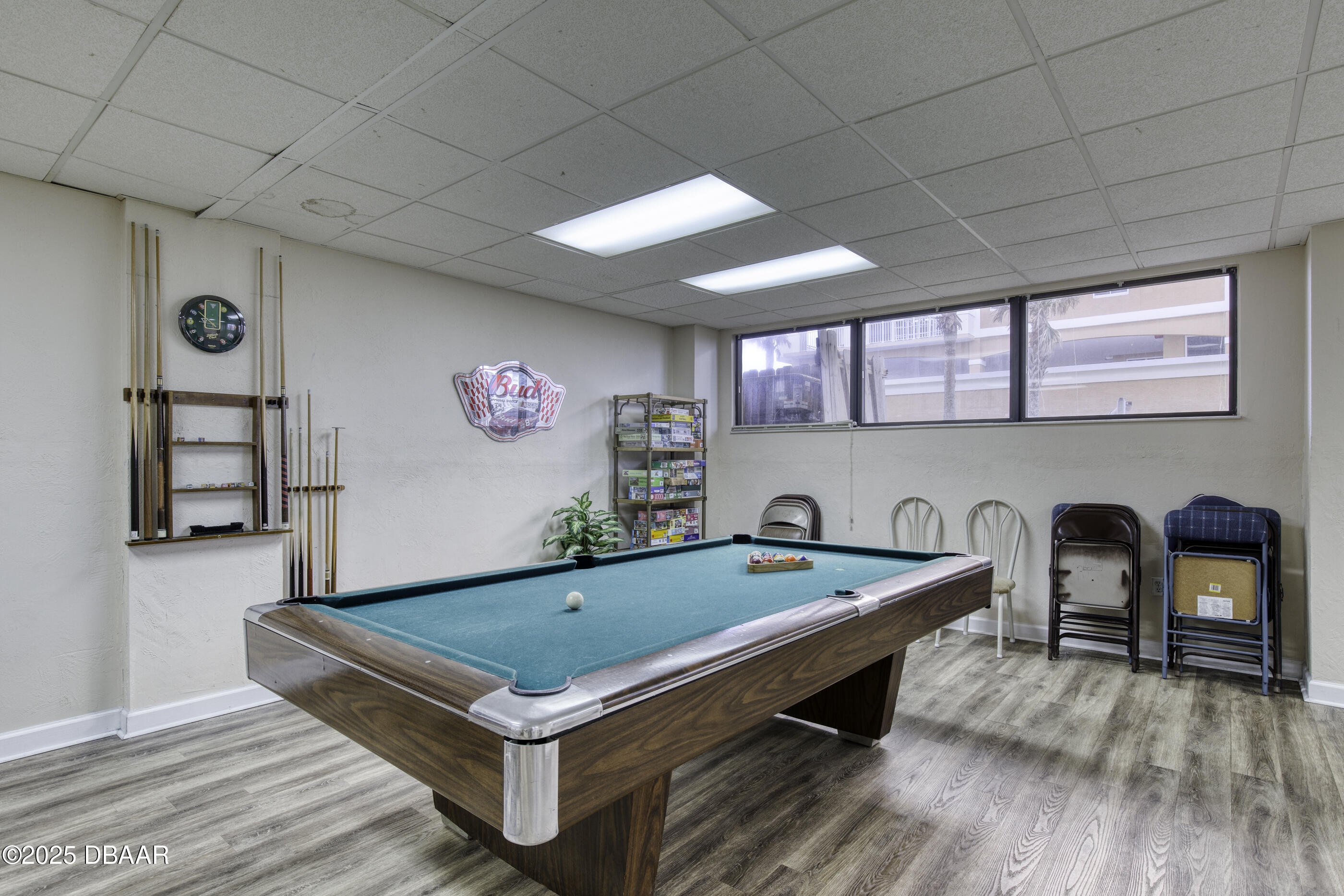 1415 Ocean Shore Boulevard, Unit 1010 Ormond Beach, FL 32176 - Photo 34 of 52 a room with pool table and windows