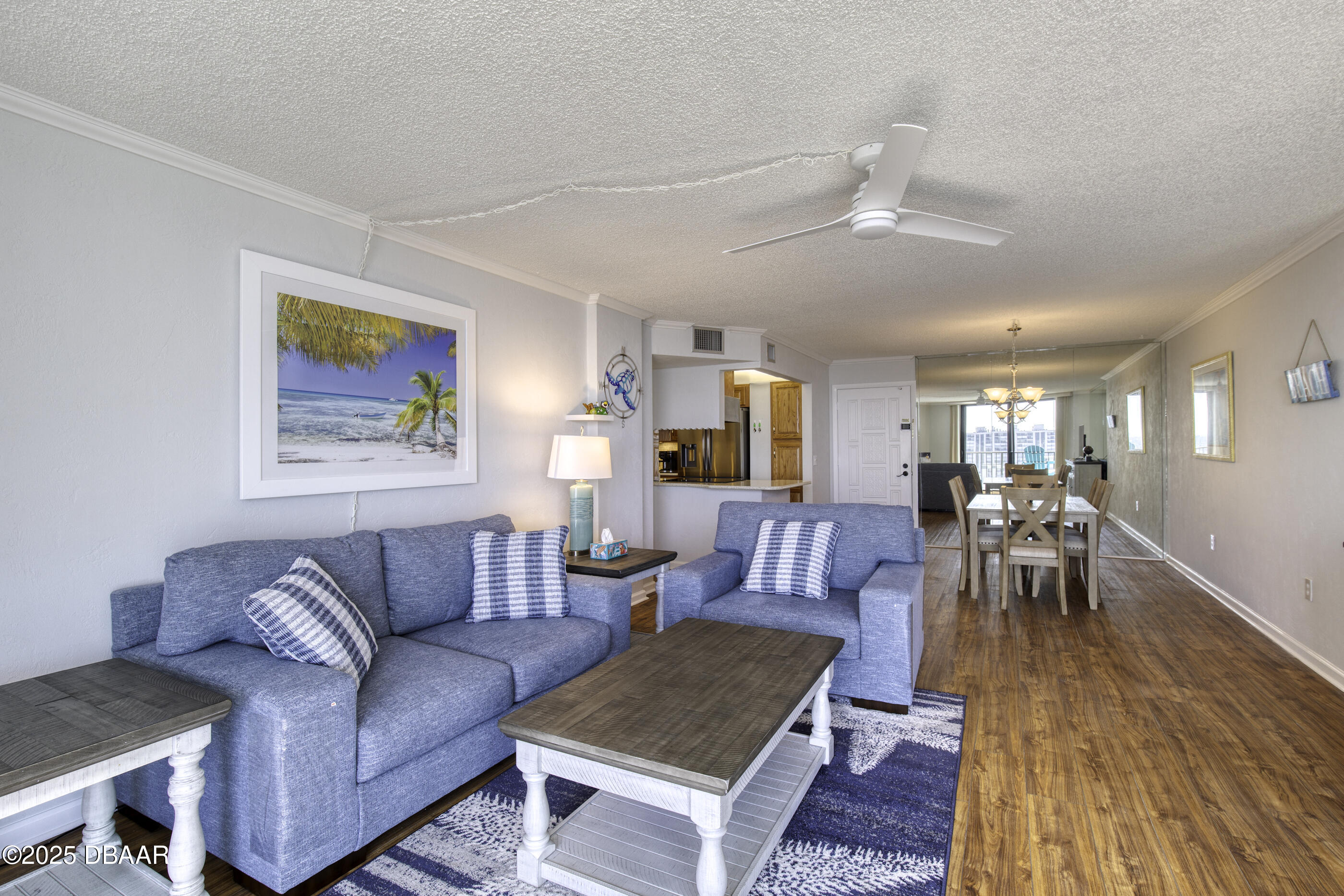 1415 Ocean Shore Boulevard, Unit 1010 Ormond Beach, FL 32176 - Photo 4 of 52 a living room with furniture and wooden floor