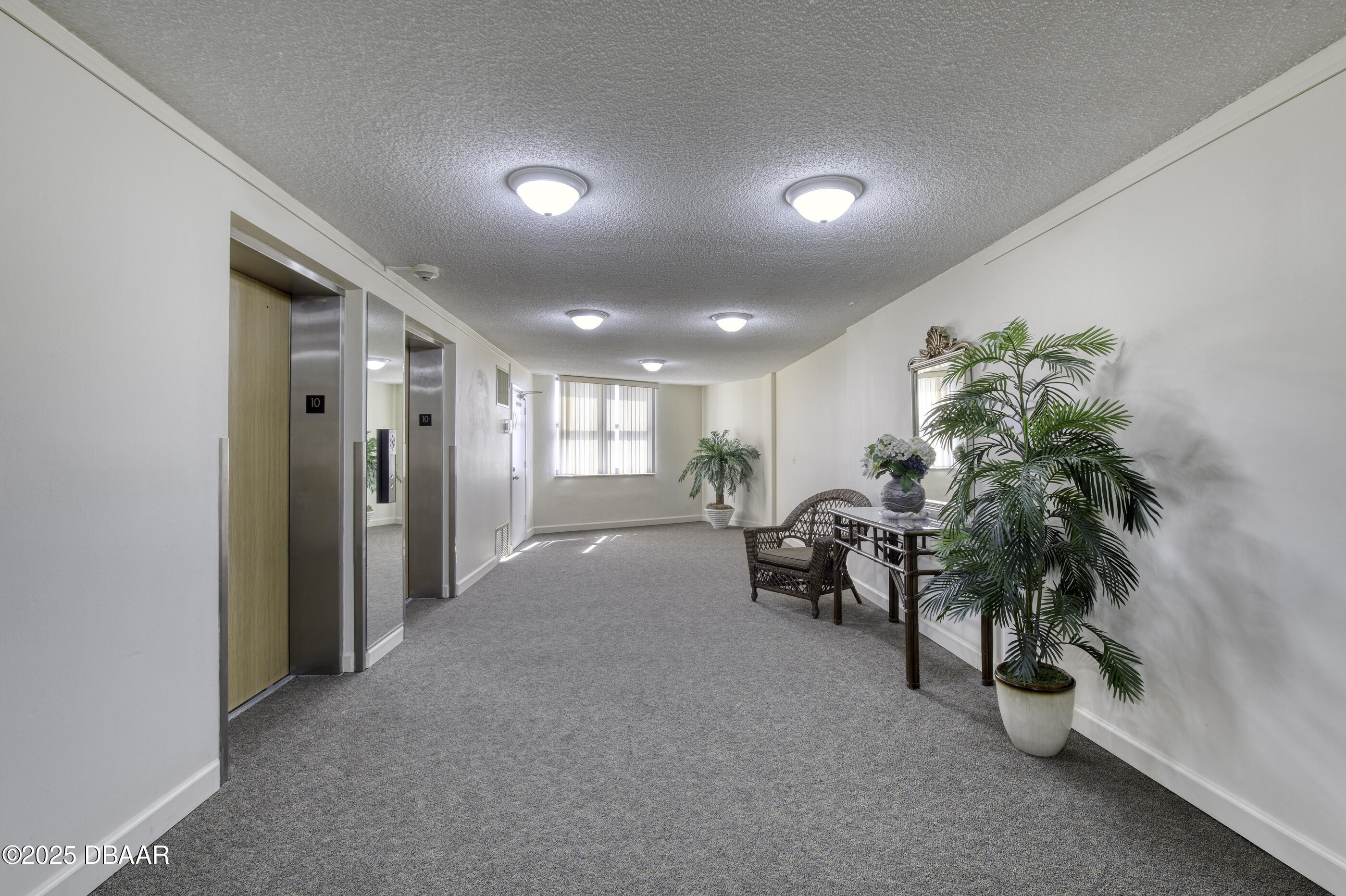 1415 Ocean Shore Boulevard, Unit 1010 Ormond Beach, FL 32176 - Photo 42 of 52 a very nice looking room with many windows