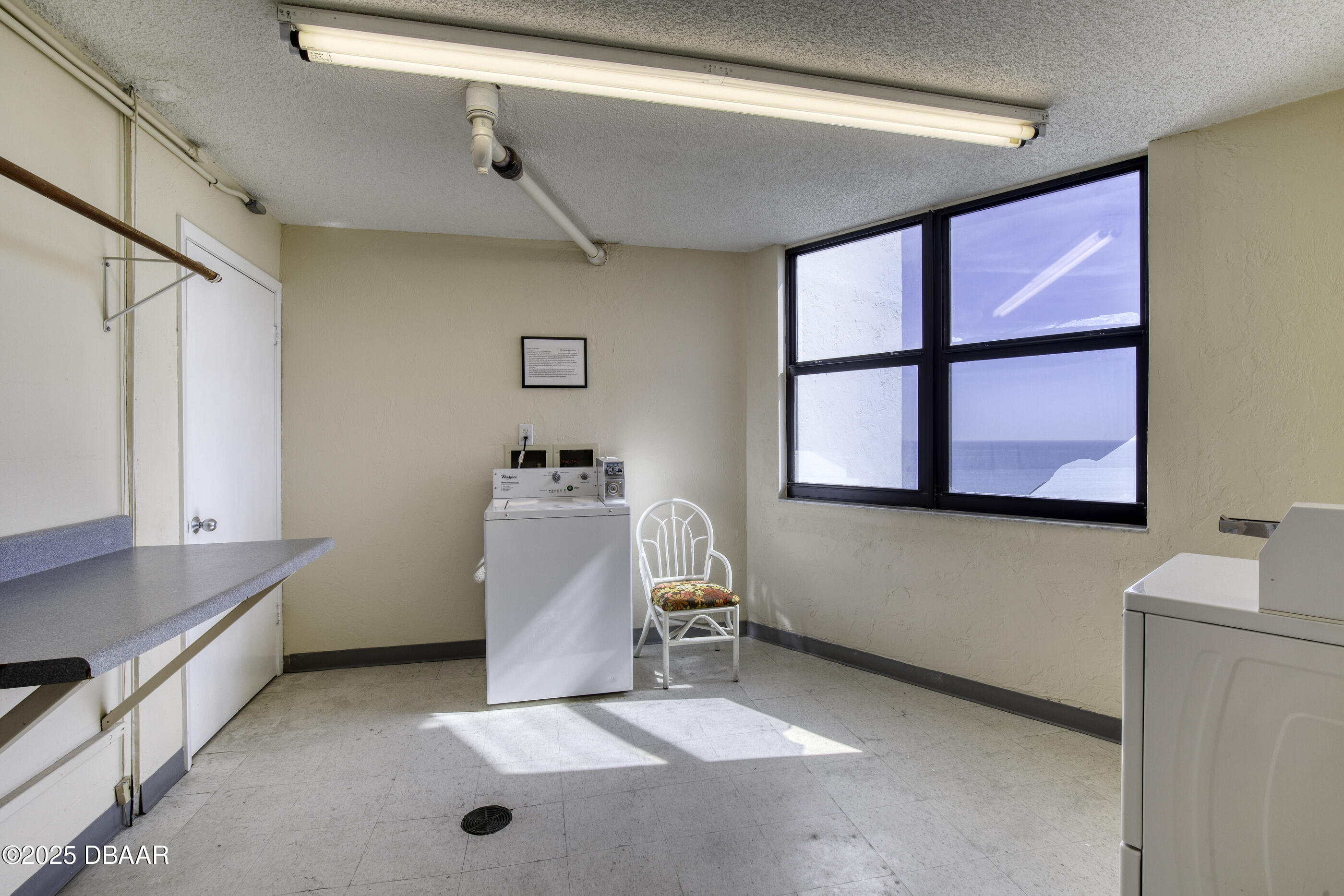 1415 Ocean Shore Boulevard, Unit 1010 Ormond Beach, FL 32176 - Photo 43 of 52 a room with a window and gym equipment