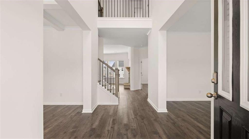 1912 Endress Circle Hampton, GA 30228 - Photo 2 of 43 a view of a hallway with wooden floor