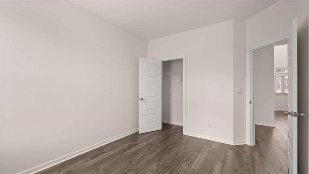 1912 Endress Circle Hampton, GA 30228 - Photo 22 of 43 a view of an empty room with wooden floor