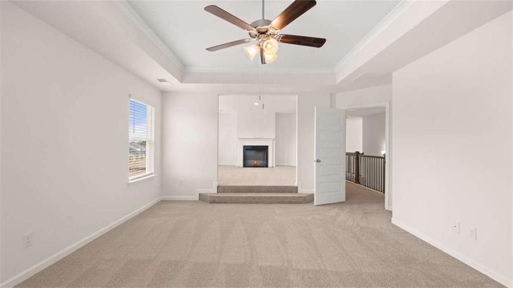 1912 Endress Circle Hampton, GA 30228 - Photo 26 of 43 a view of a livingroom with a ceiling fan and window