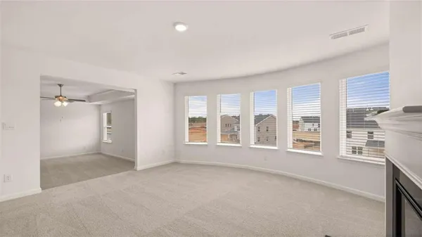 a view of an empty room with a window