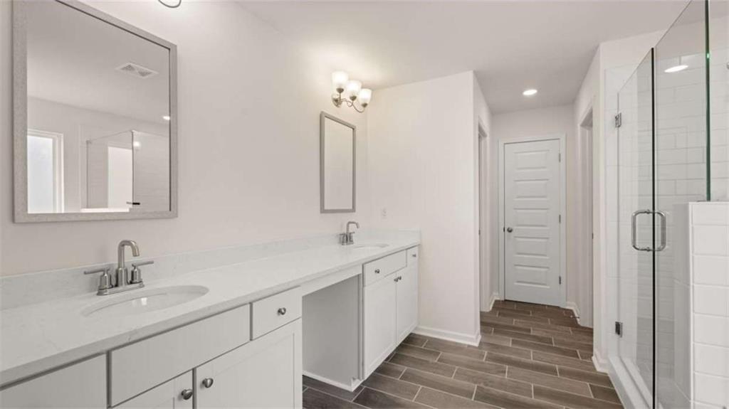 1912 Endress Circle Hampton, GA 30228 - Photo 29 of 43 a bathroom with a sink and a mirror