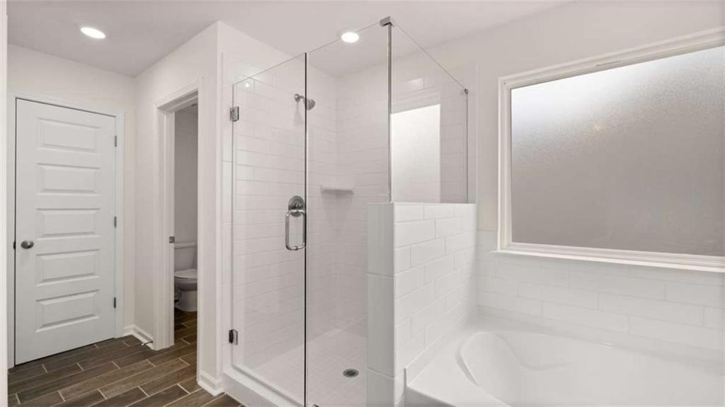 1912 Endress Circle Hampton, GA 30228 - Photo 31 of 43 a bathroom with a shower and a glass door