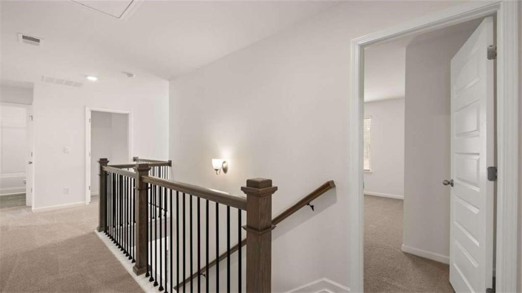1912 Endress Circle Hampton, GA 30228 - Photo 33 of 43 a view of a hallway with windows and stairs