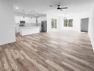 a view of a kitchen with a sink and cabinets