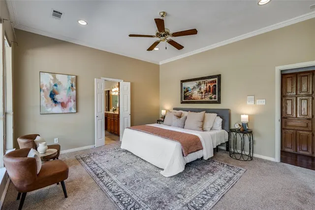 a work room with furniture a rug and a window