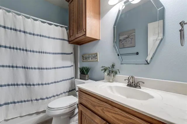 a bedroom with a bed and a fireplace