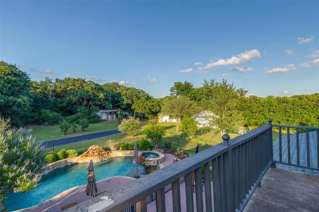 a bedroom with a bed and ceiling fan