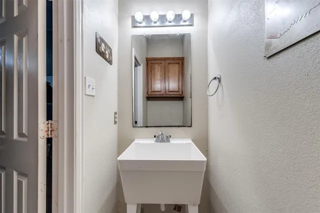 a view of a big house with a big yard and large trees