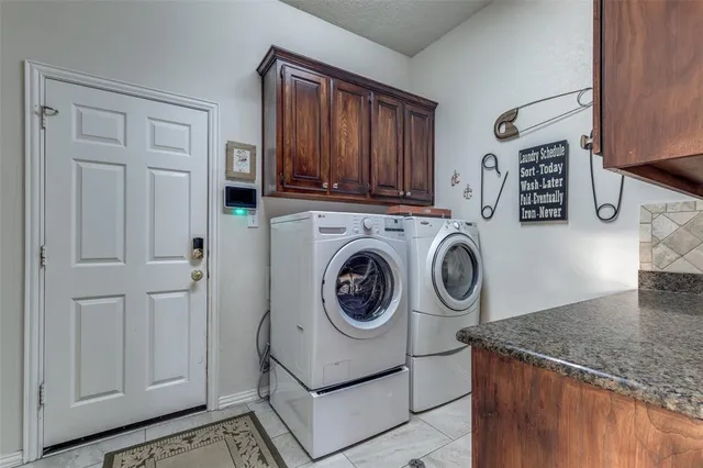 a large bathroom with a double vanity sink a large mirror a bathtub and shower