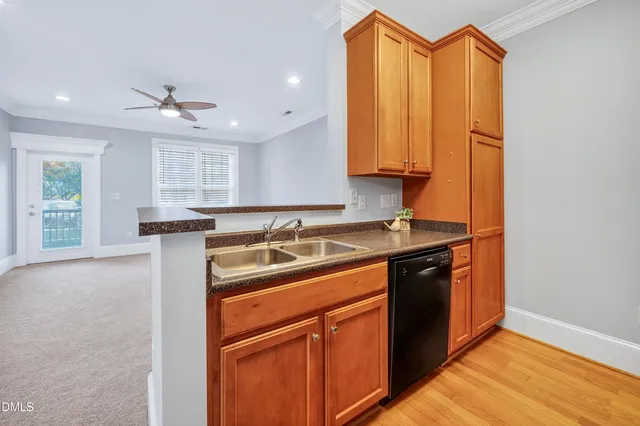 a kitchen with a sink and a refrigerator