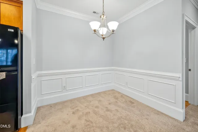 a view of an entryway with chandelier