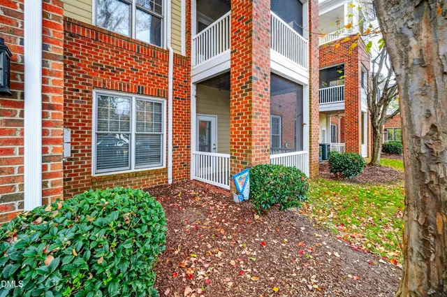 front view of a brick house with a large windows