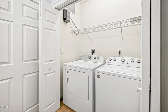 a view of a dining room with furniture large windows and wooden floor