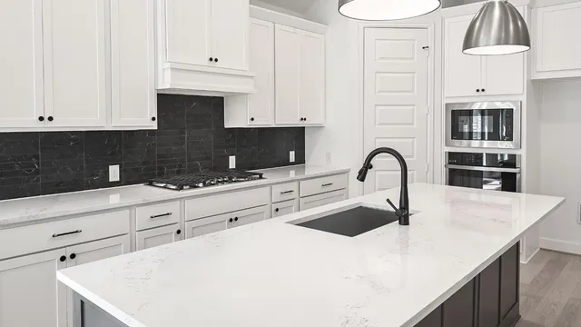 a bathroom with a sink a washer and dryer