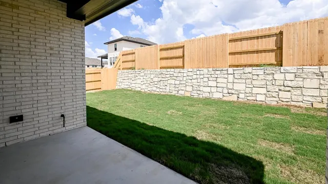 a kitchen with a sink a window and cabinets