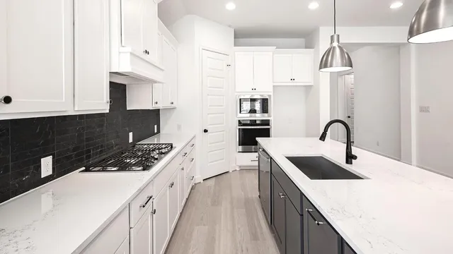 an empty room with chandelier fan