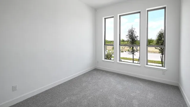 a en suite bathroom with a granite countertop sink and a mirror