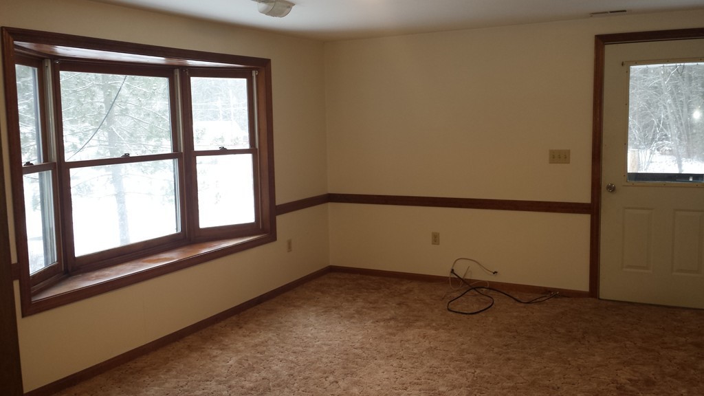 22 Scott Road Townsend, MA 01474 - Photo 12 of 24 a view of a room with rack on the wall and a window