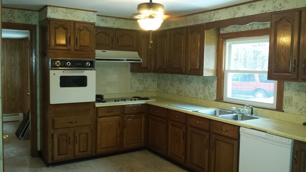 22 Scott Road Townsend, MA 01474 - Photo 5 of 24 a kitchen with a sink and cabinets