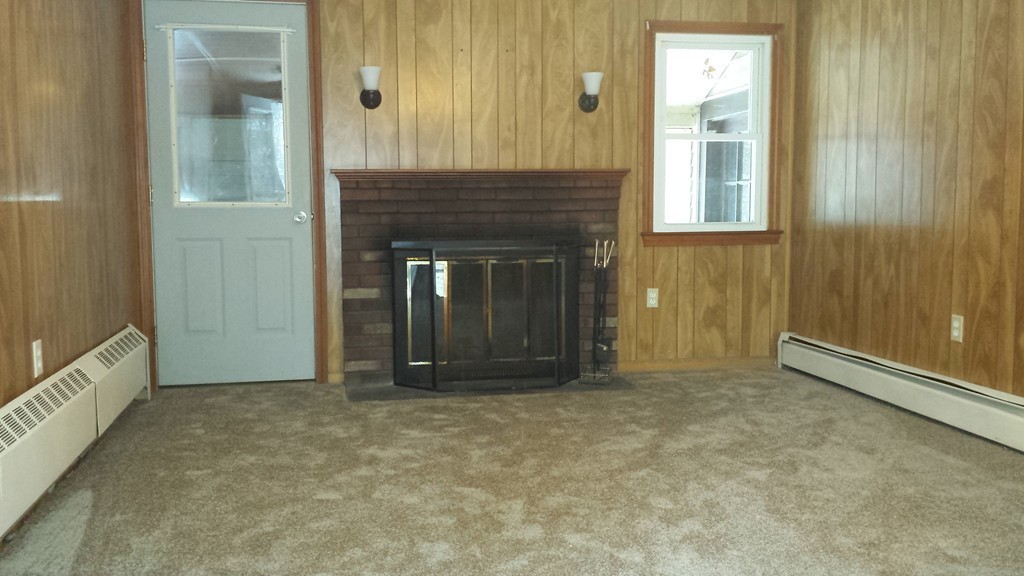 22 Scott Road Townsend, MA 01474 - Photo 6 of 24 an empty room with windows and entrance