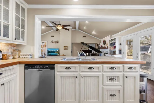 a kitchen with stainless steel appliances a refrigerator stove and microwave