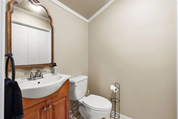 a bathroom with a sink vanity and a mirror