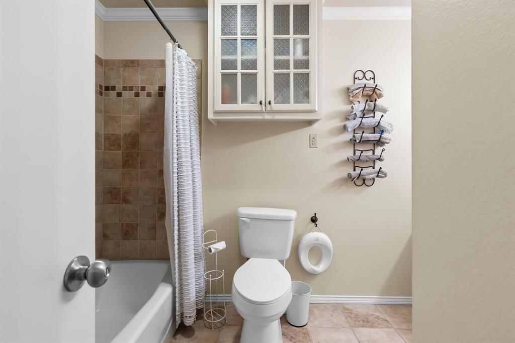 601 Rasure Circle Sulphur Springs, TX 75482 - Photo 27 of 40 a white toilet sitting next to a bathroom sink