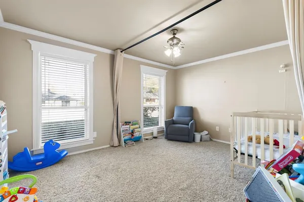 a bedroom with furniture and a window