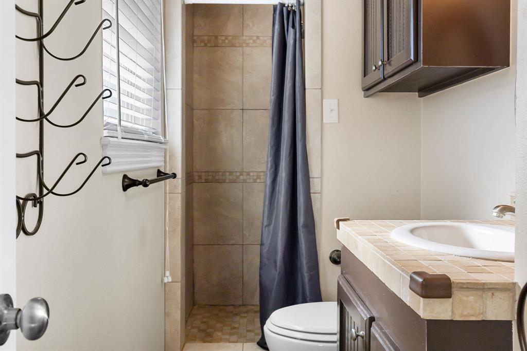 601 Rasure Circle Sulphur Springs, TX 75482 - Photo 36 of 40 a bathroom with a sink a toilet and shower