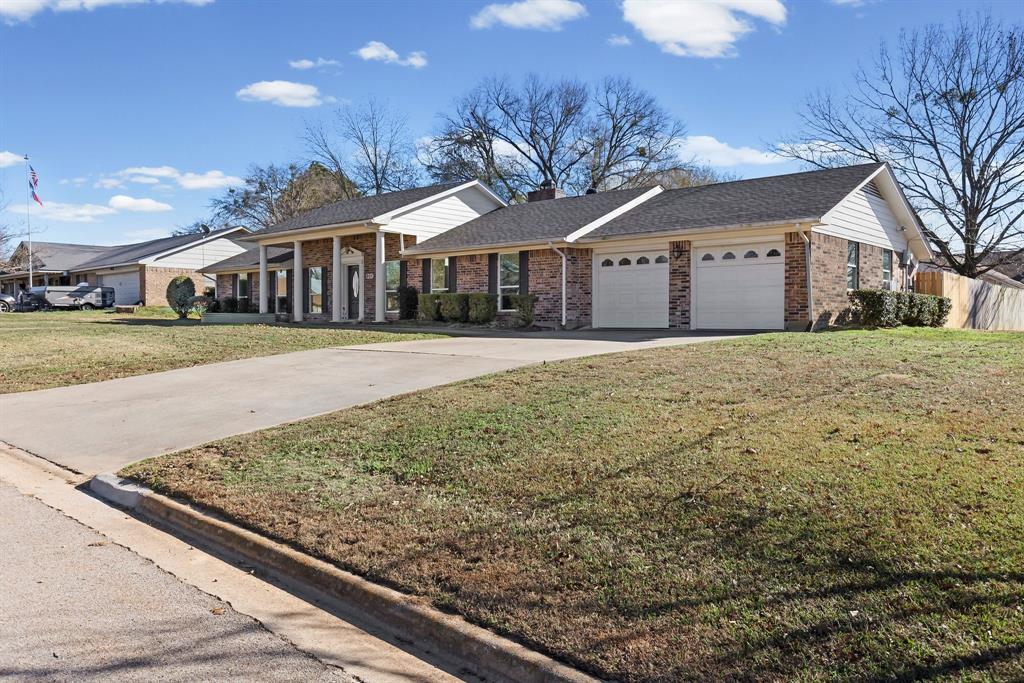 601 Rasure Circle Sulphur Springs, TX 75482 - Photo 8 of 40 a front view of a house with a yard and garage