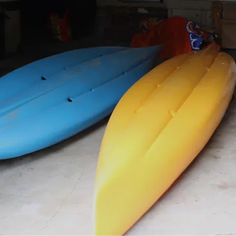 a view of a room with bed and a potted plant