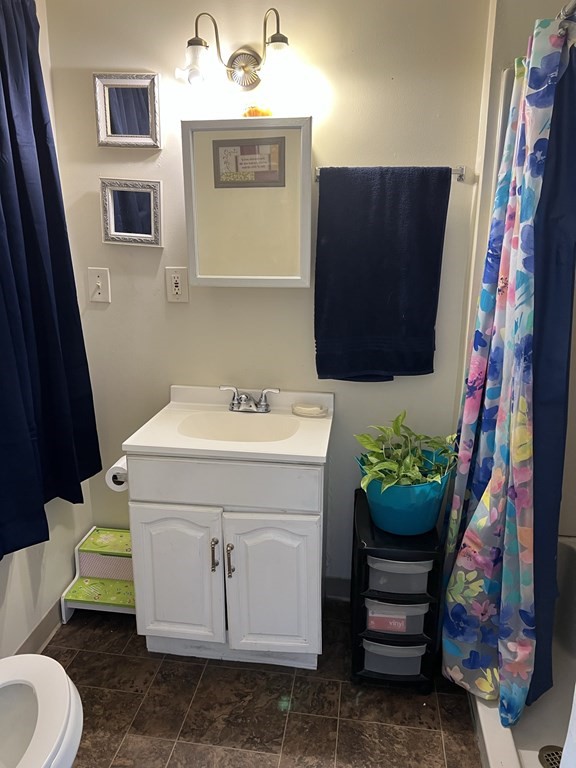 2-4 Prospect Street Haverhill, MA 01832 - Photo 11 of 42 a bathroom with a sink and a mirror