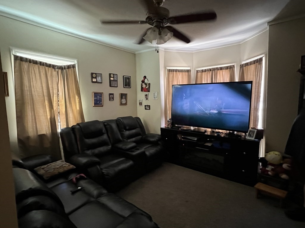 2-4 Prospect Street Haverhill, MA 01832 - Photo 20 of 42 a living room with furniture and a flat screen tv