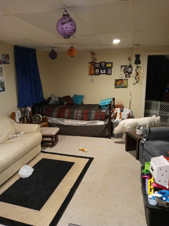 2-4 Prospect Street Haverhill, MA 01832 - Photo 25 of 42 a living room with furniture and a flat screen tv