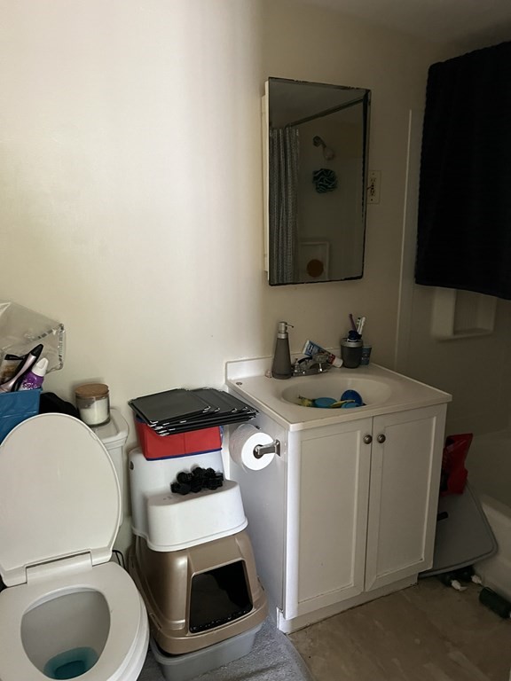 2-4 Prospect Street Haverhill, MA 01832 - Photo 26 of 42 a bathroom with a toilet sink and mirror