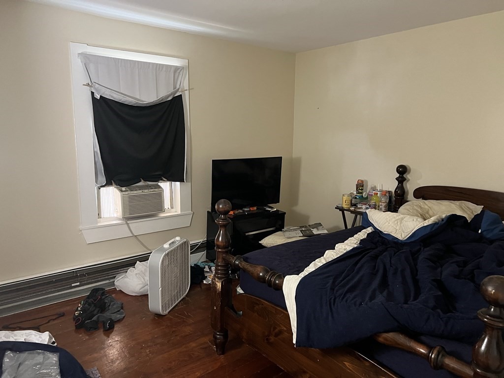 2-4 Prospect Street Haverhill, MA 01832 - Photo 27 of 42 a bedroom with a bed and a flat screen tv