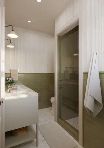 a bathroom with a sink a toilet and shower