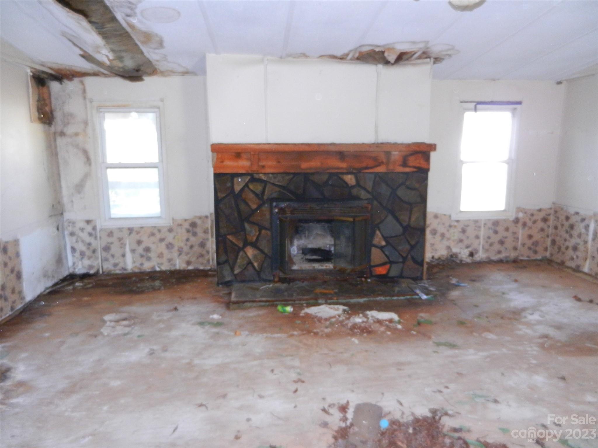 265 Union New Hope Road Gastonia, NC 28056 - Photo 5 of 7 a view of empty room with fireplace and windows