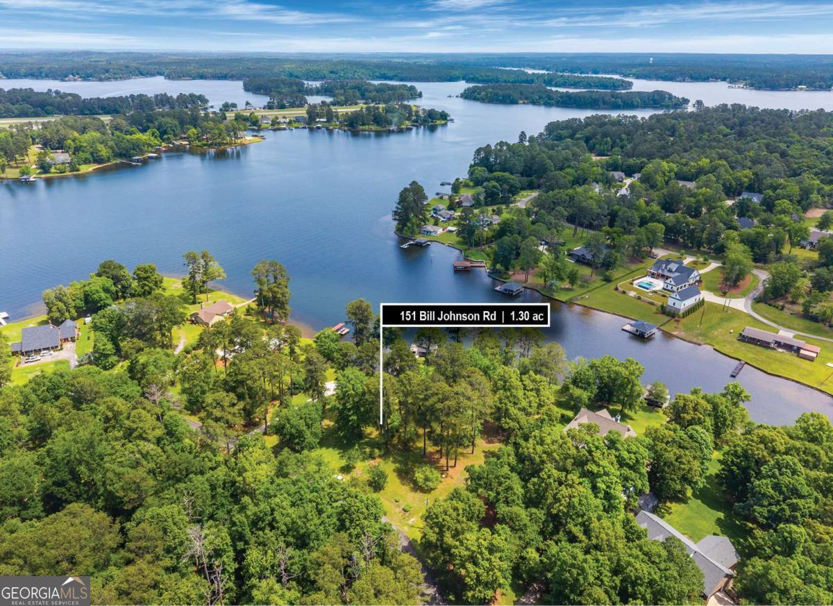 151 Bill Johnson Road Northeast Milledgeville, GA 31061 - Photo 5 of 27 an aerial view of residential houses with outdoor space and lake view