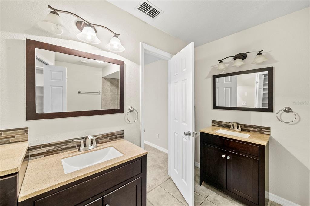 6601 North Elizabeth Street Tampa, FL 33604 - Photo 20 of 35 a bathroom with a sink vanity and mirror