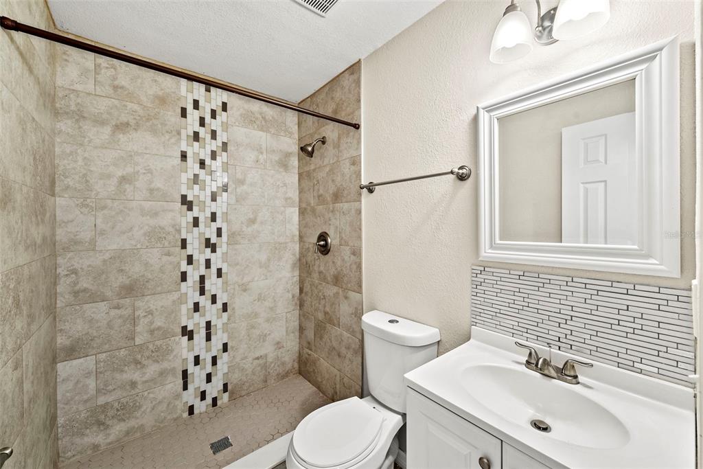 6601 North Elizabeth Street Tampa, FL 33604 - Photo 25 of 35 a bathroom with a sink a toilet and shower