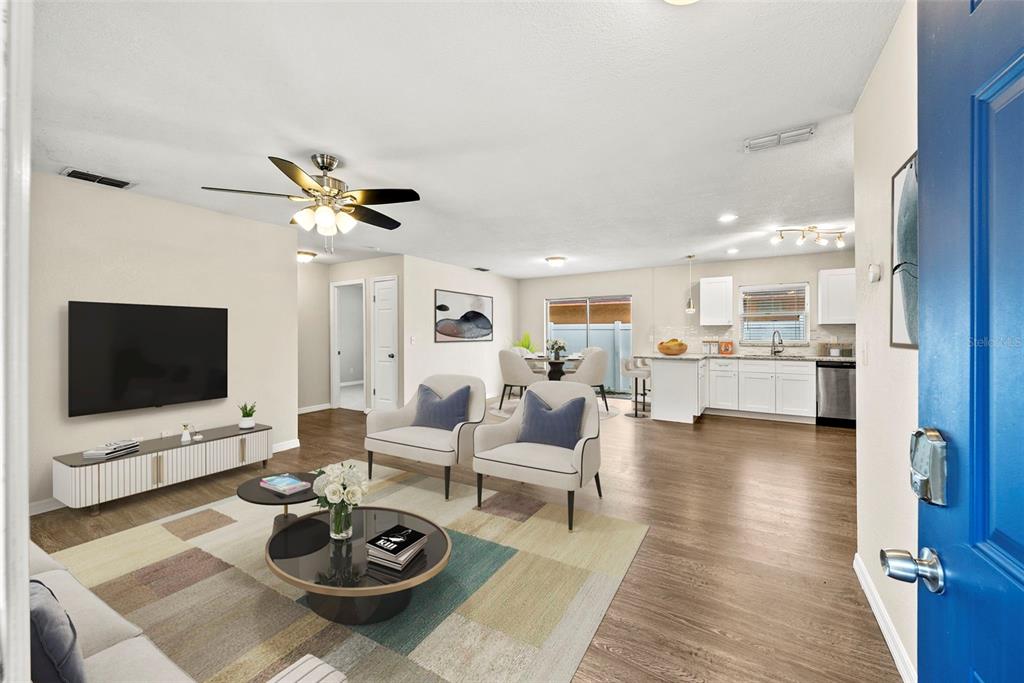 6601 North Elizabeth Street Tampa, FL 33604 - Photo 3 of 35 a living room with furniture and a flat screen tv