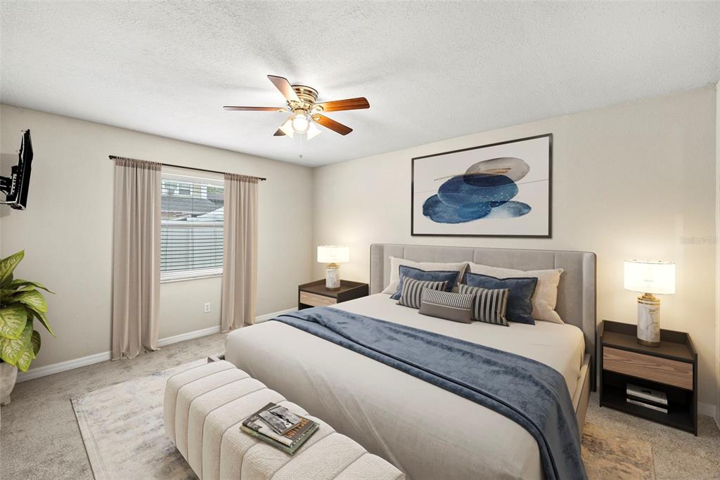 6601 North Elizabeth Street Tampa, FL 33604 - Photo 5 of 35 a bedroom with a large bed and a chandelier