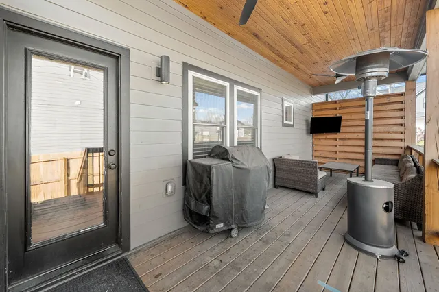 a view of a door and chair in the balcony