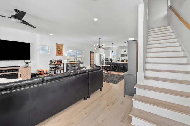 a kitchen with stainless steel appliances and view living room